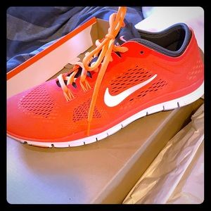 Neon coral Nike Fee run. Brand new w/box size 8.5